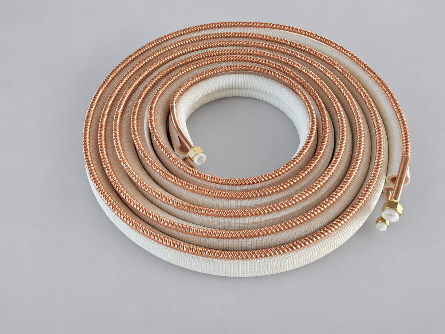Partially exposed corrugated copper line set with flare nuts fitted